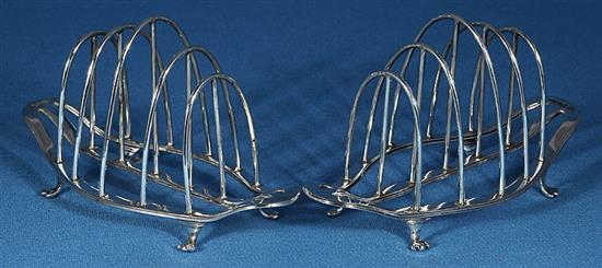 A pair of George V silver toast racks, by George Howson, Length 153mm weight 8.1oz/253grms